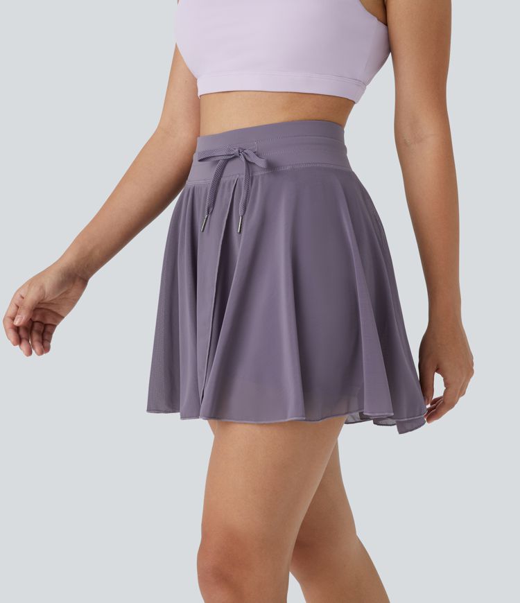 Falda mini acampanada fluida bolsillo lateral 2 en 1 malla contrastante cordón tiro alto