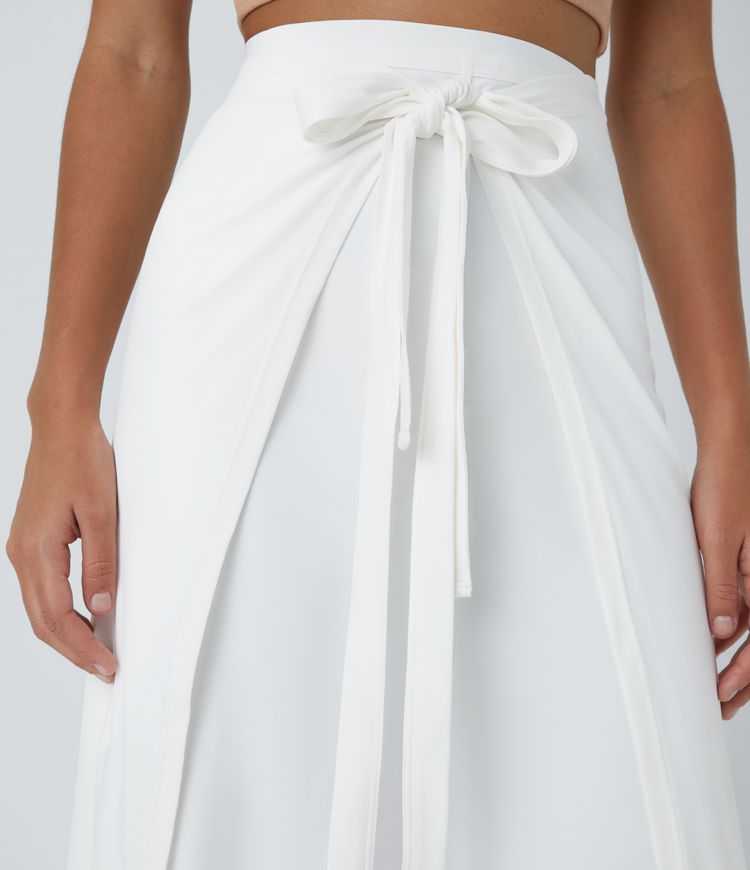 Pantalón palazzo fluido ancho con tiro alto y lazo delantero