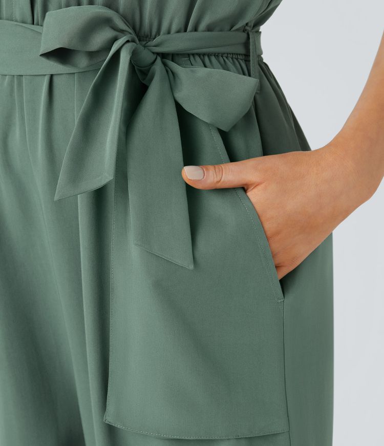 V-neck sleeveless zipper belted jumpsuit with side pocket details in a casual style.