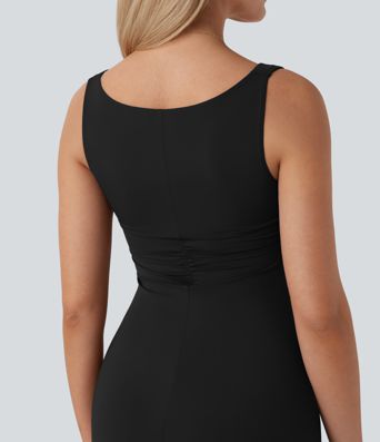 Long, fitted, sleeveless party dress with a gathered turn-neck and turtleneck.