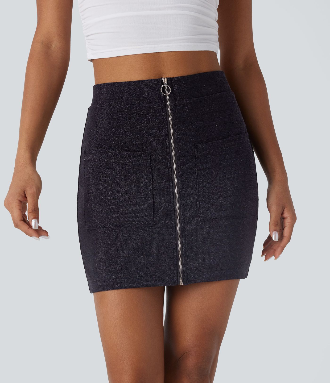 Minifalda casual ajustada de tiro alto con cremallera y bolsillos delanteros