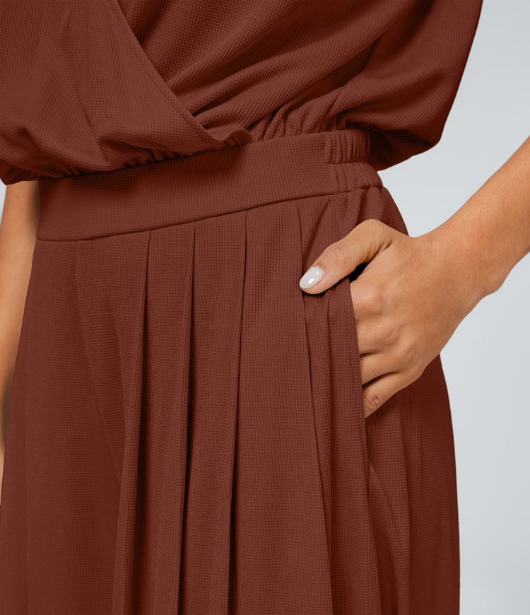 Mono cuello V manga corta bolsillo lateral plisado pierna ancha