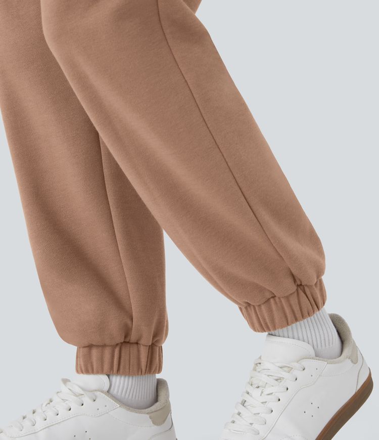 Jogging en polaire taille haute avec poches latérales et fermeture zippée