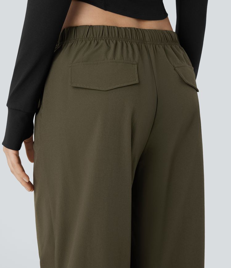 Pantalón entrenamiento holgado pierna ancha dobladillo ajustable bolsillo lateral cordón tiro bajo