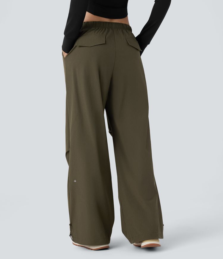 Pantalón entrenamiento holgado pierna ancha dobladillo ajustable bolsillo lateral cordón tiro bajo