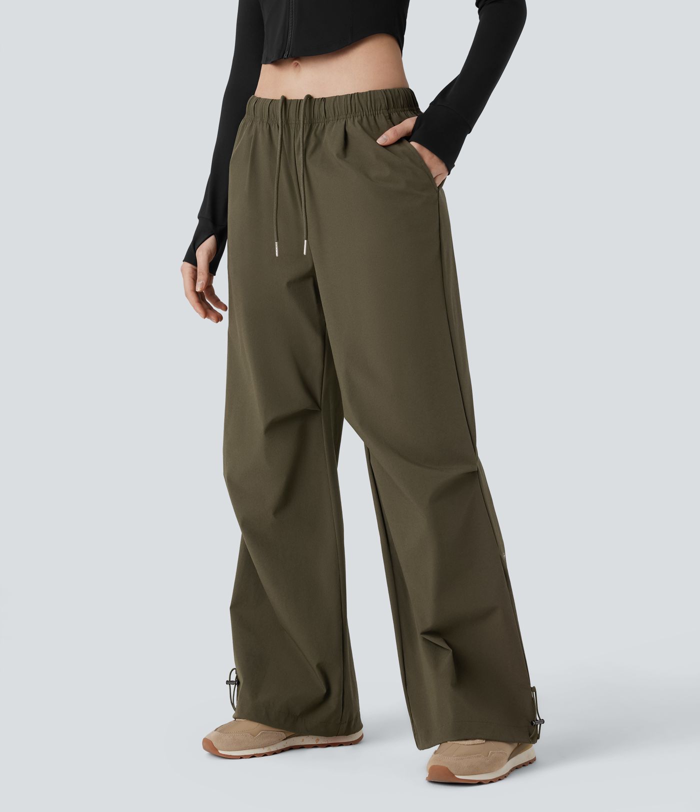 Pantalón entrenamiento holgado pierna ancha dobladillo ajustable bolsillo lateral cordón tiro bajo