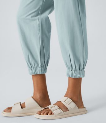 Keskikorkeat puuvillaiset rennot joggerit vetoketjutaskulla