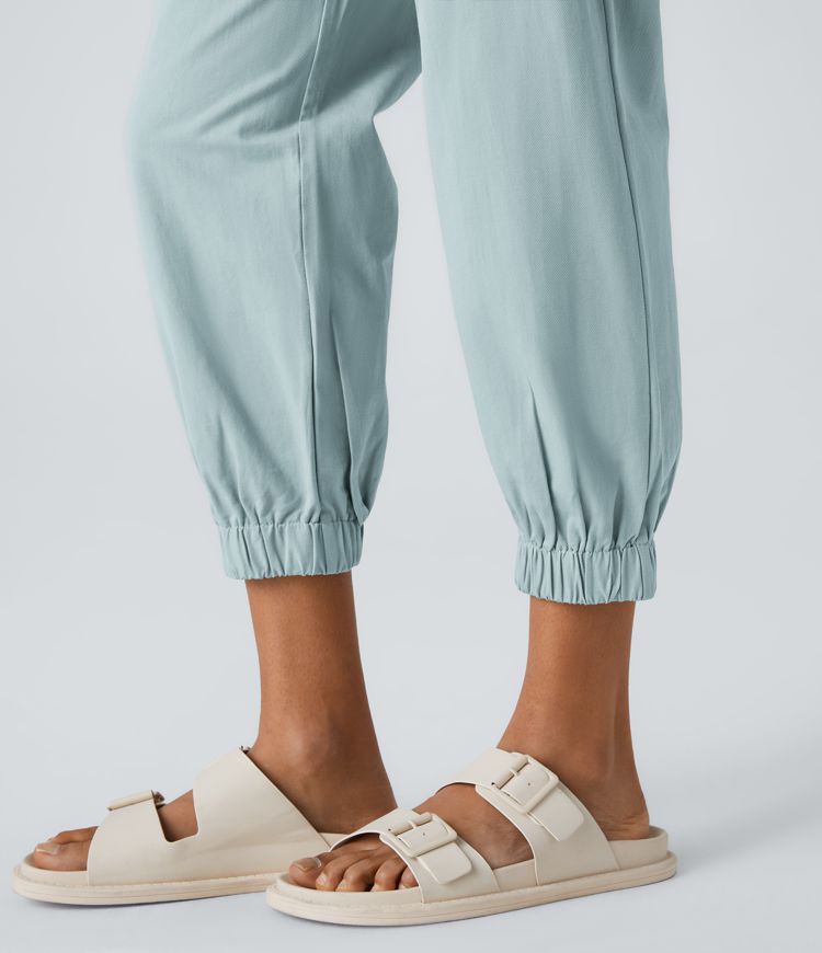 Keskikorkeat puuvillaiset rennot joggerit vetoketjutaskulla