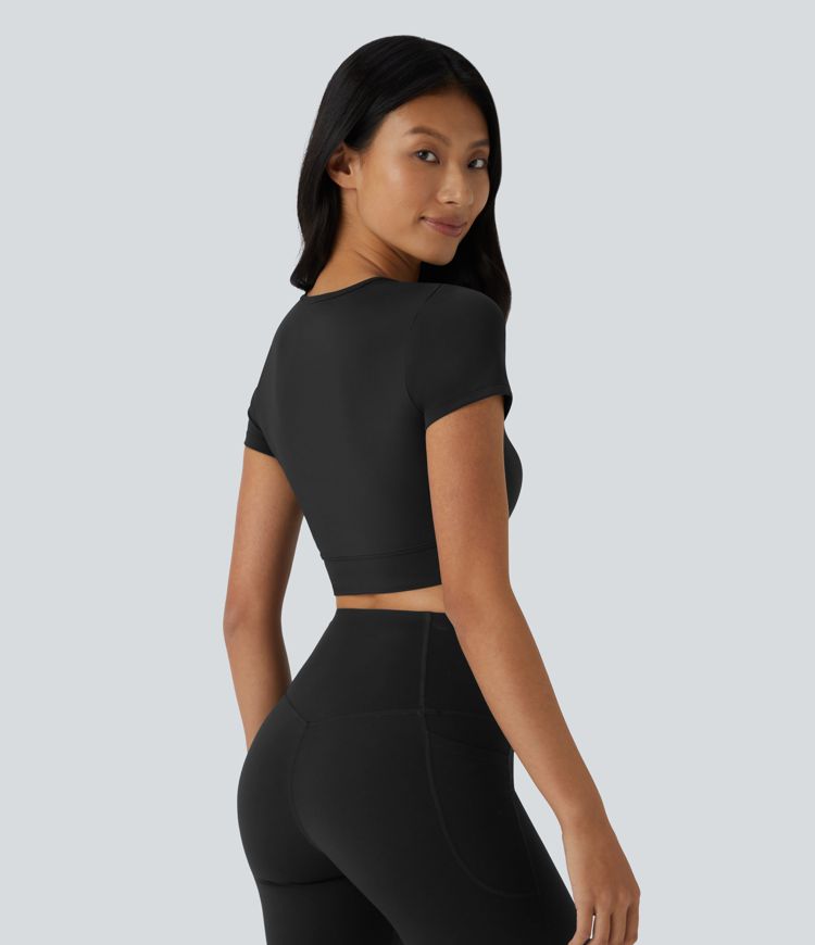 Top sportivo corto SoftlyZero™ con bordo incrociato