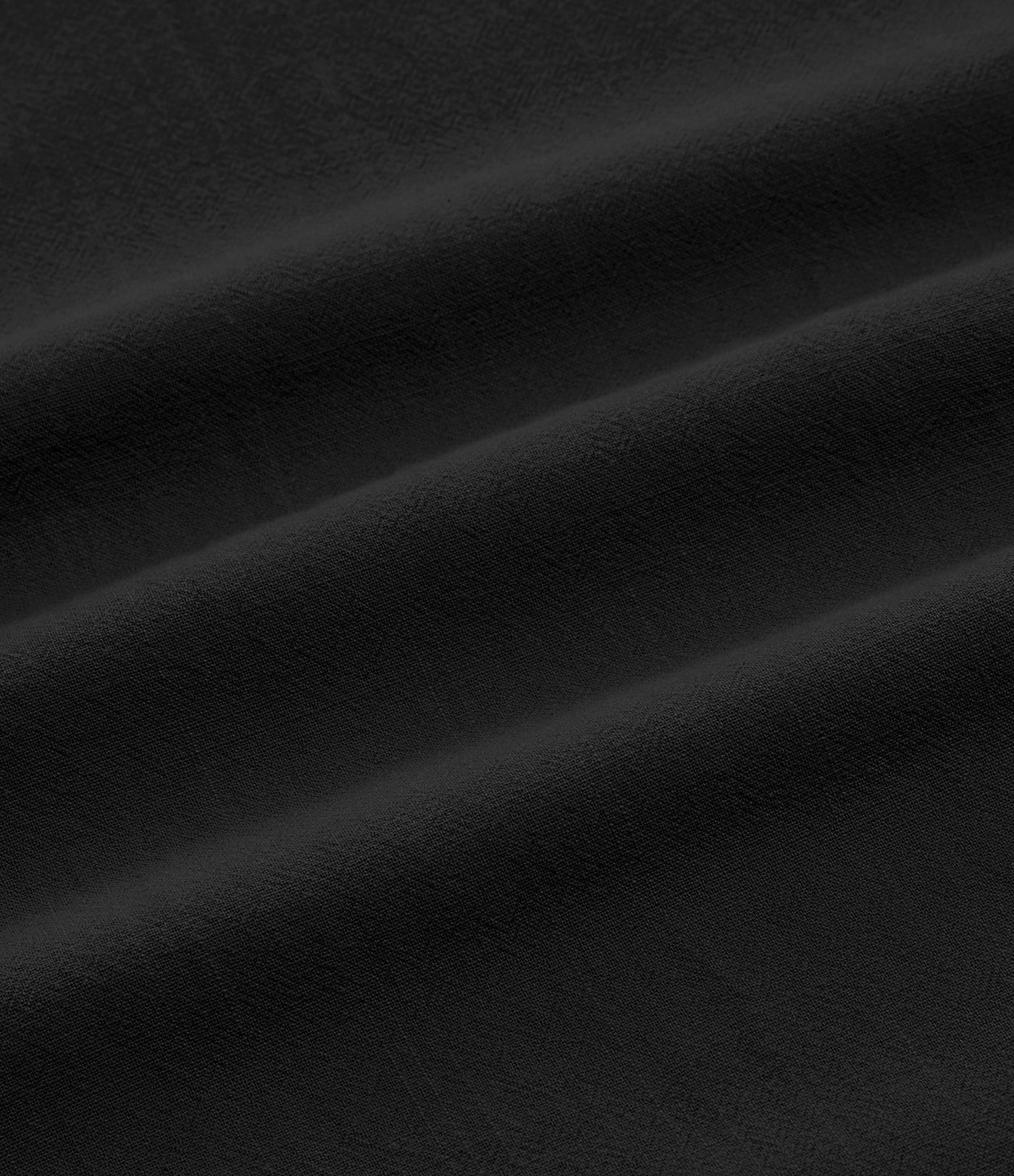 Pantalón tiro alto bolsillo lateral plisado pierna ancha