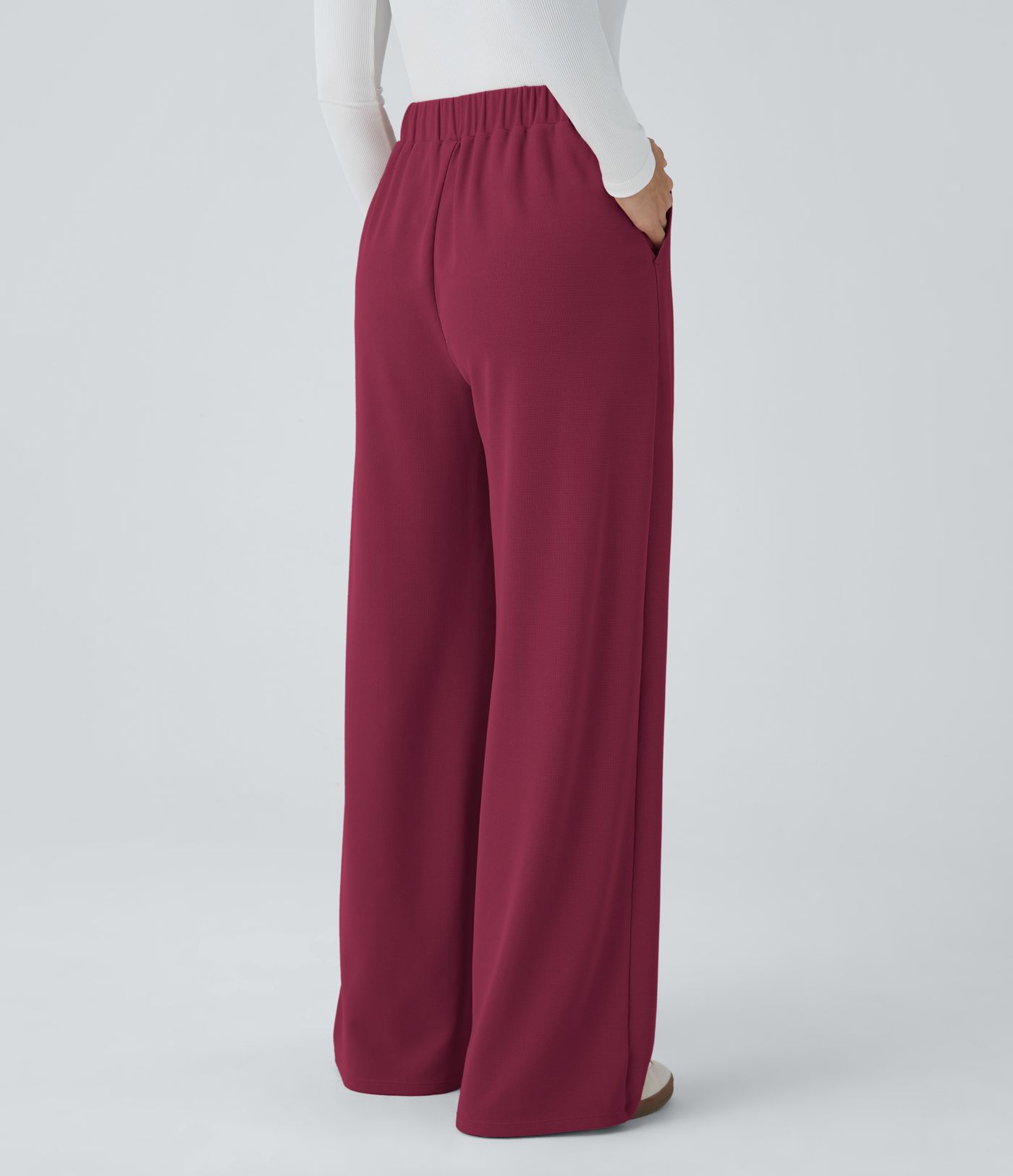 Pantalón tiro alto botón bolsillo lateral plisado pierna ancha