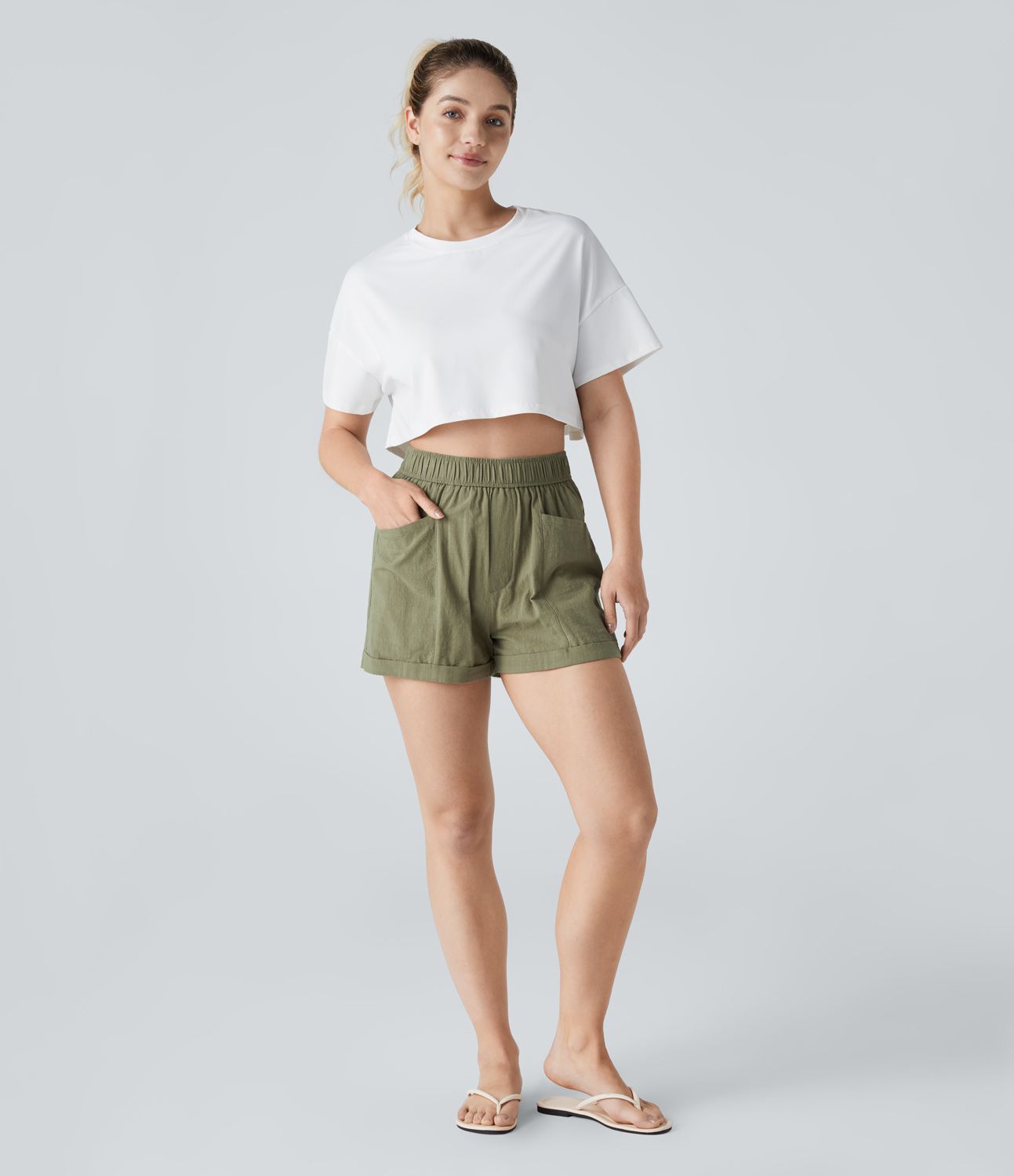 Casual shorts with high waist, multiple pockets, and rolled hem in linen-like appearance