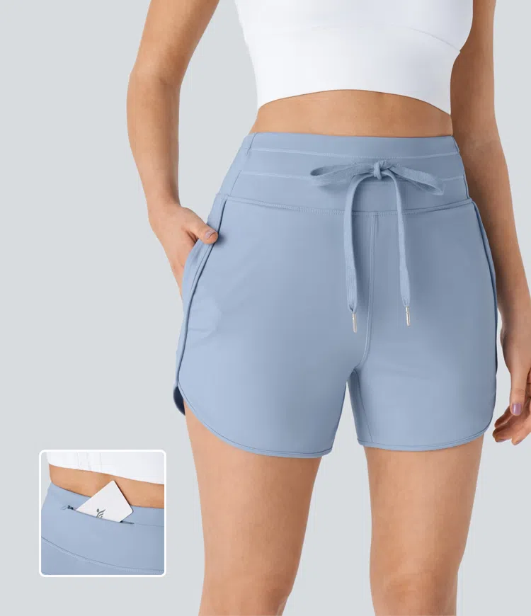 High-waist drawstring multiple pocket curved hem yoga shorts