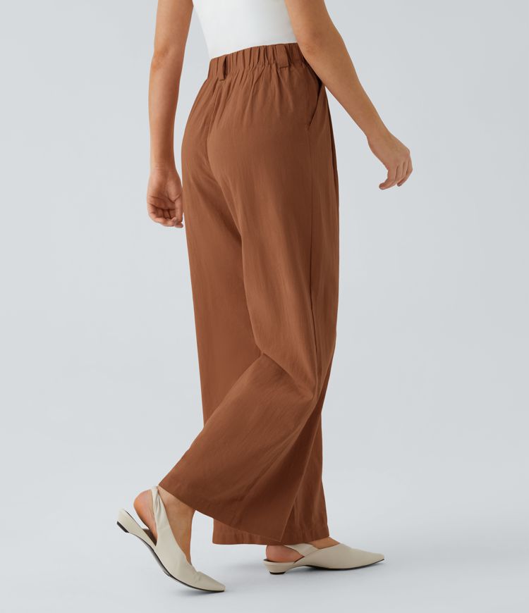 High-waisted trousers with pleated side pockets and wide legs