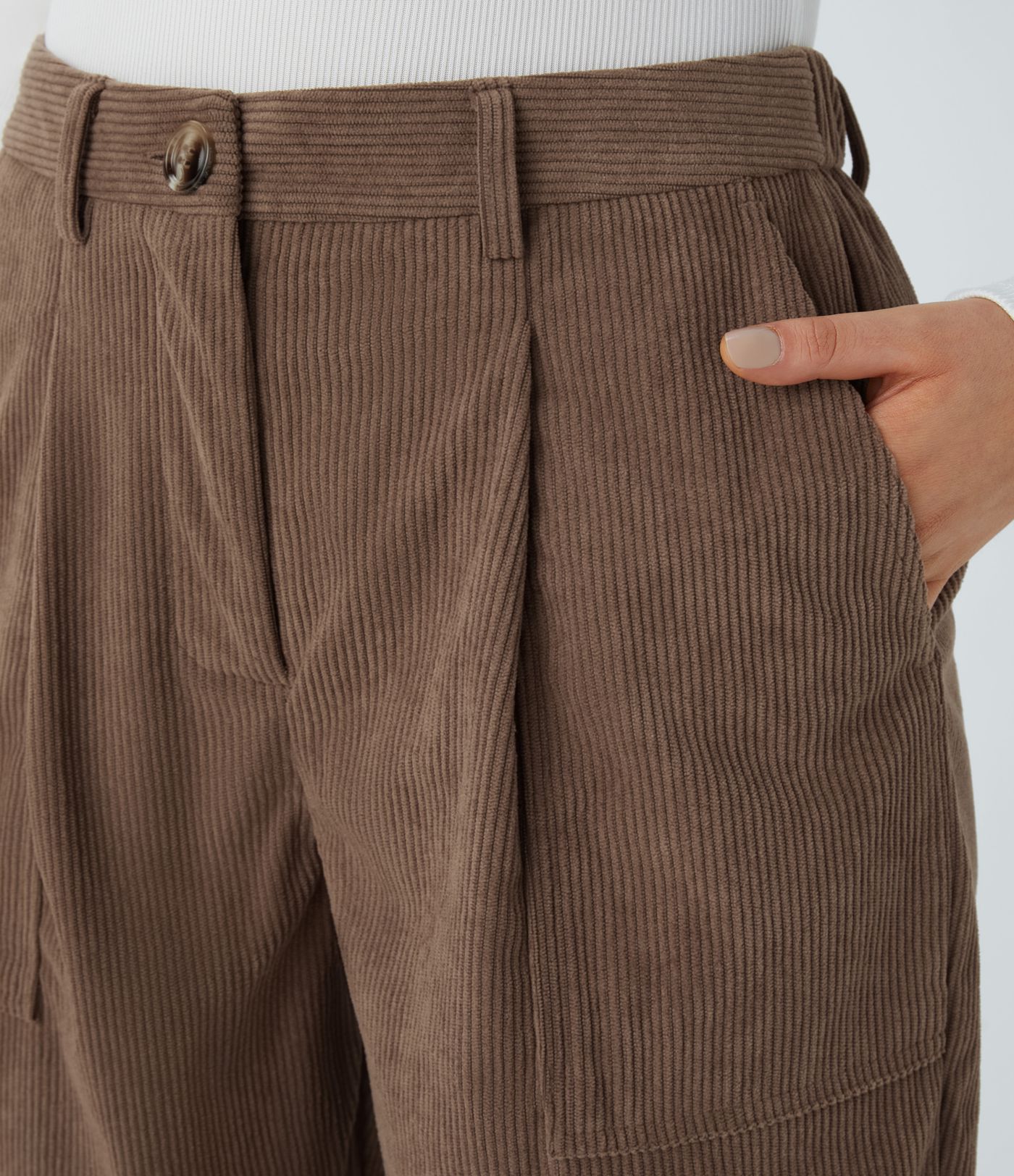 Casual corduroy jogger pants with mid waist, button, zipper, and multiple pockets