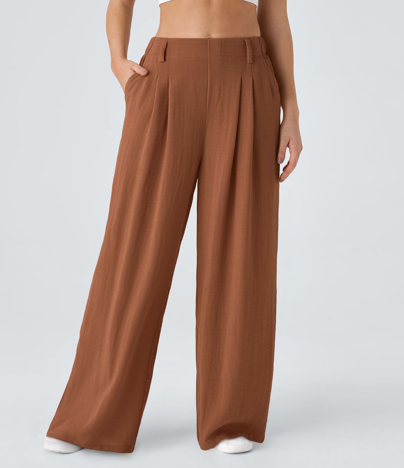 High-waisted trousers with pleated side pockets and wide legs