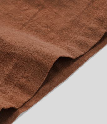 High-waisted trousers with pleated side pockets and wide legs