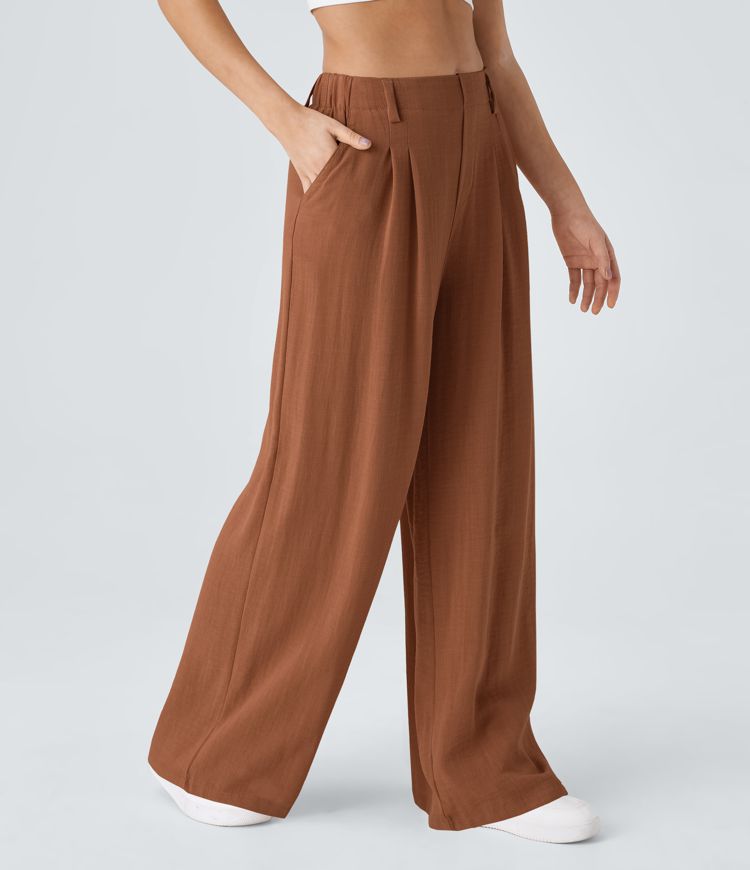 High-waisted trousers with pleated side pockets and wide legs