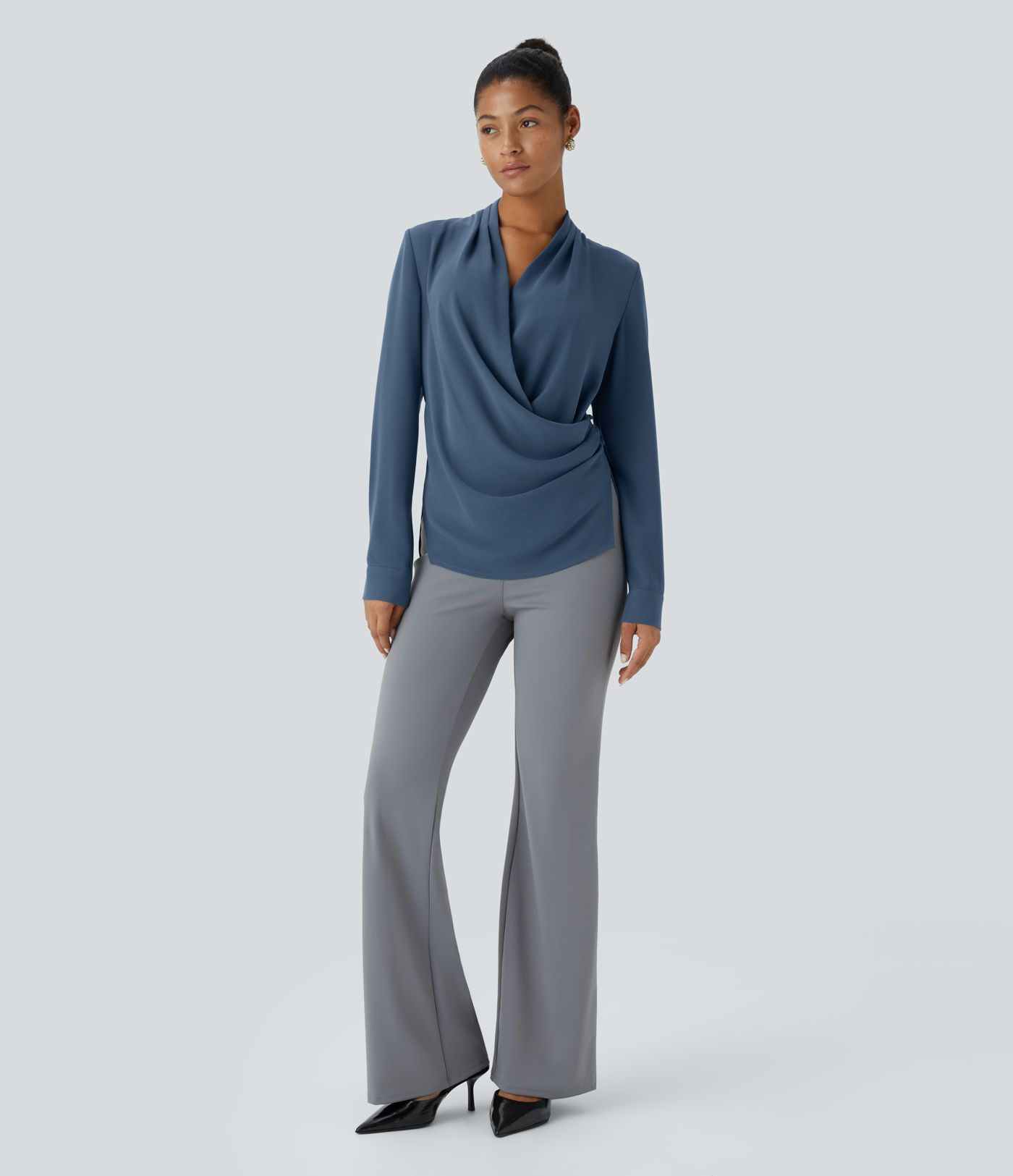 Wrap-front work blouse with V-neckline, ruffles, long sleeves and a slit.