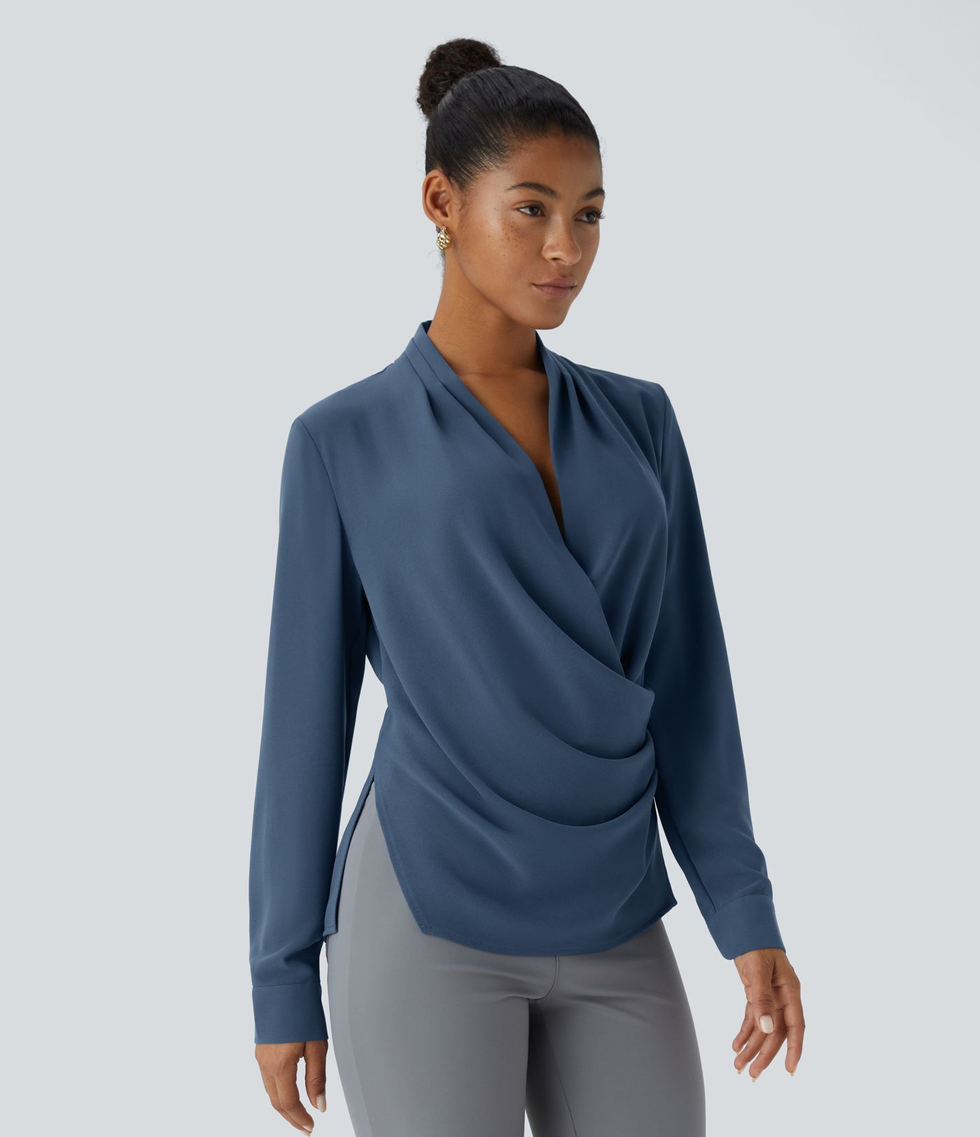 Wrap-front work blouse with V-neckline, ruffles, long sleeves and a slit.