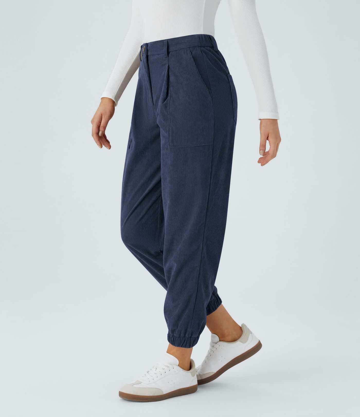 Casual corduroy jogger pants with mid-rise waist, button, zipper, and multiple pockets