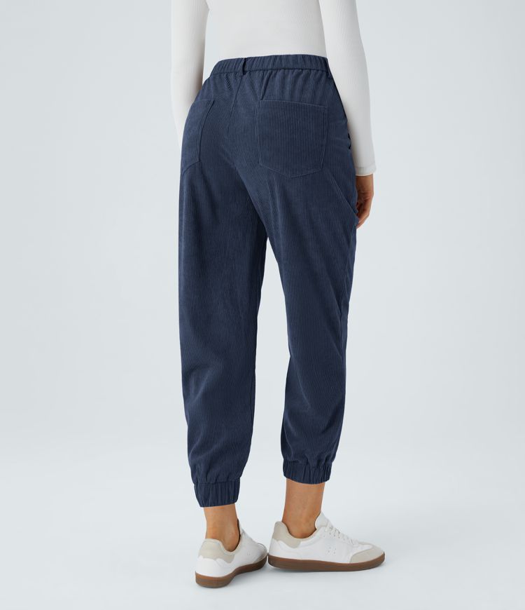 Casual corduroy jogger pants with mid-rise waist, button, zipper, and multiple pockets