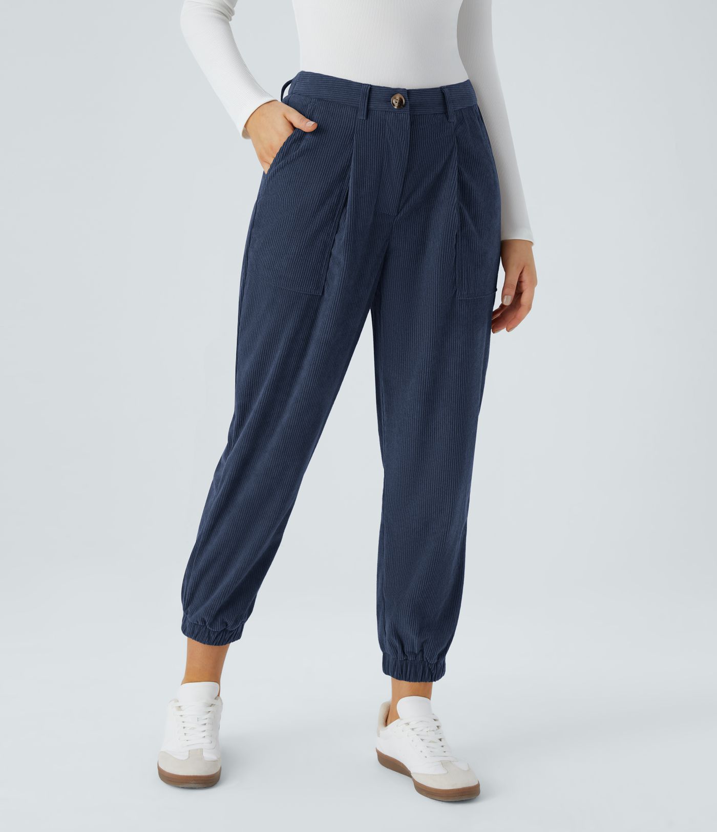 Casual corduroy jogger pants with mid-rise waist, button, zipper, and multiple pockets