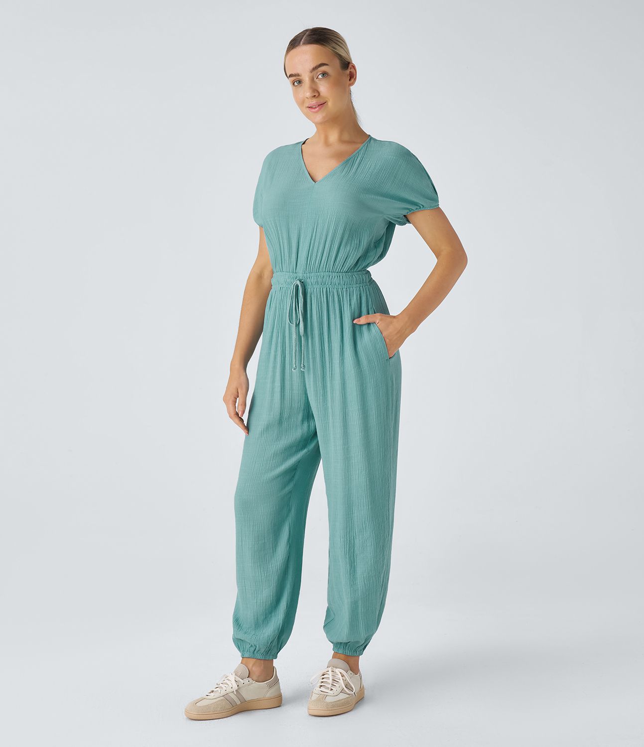 Pleated, relaxed jogger jumpsuit with V-neck, keyhole back, short sleeves, drawstring and side pockets