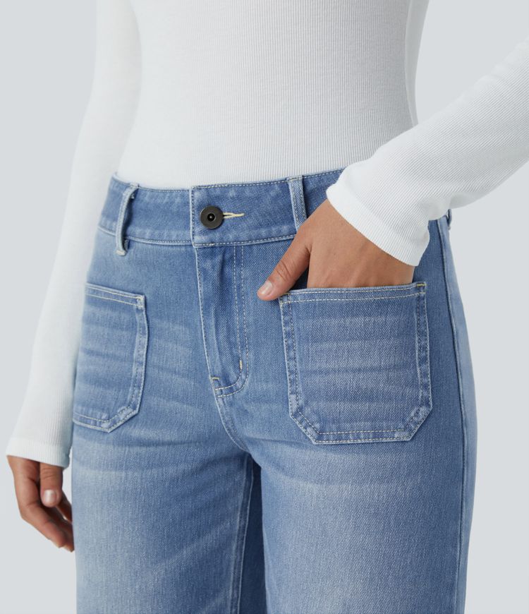 Jean décontracté délavé taille basse en maille extensible, coupe droite avec poches avant et fermeture zippée