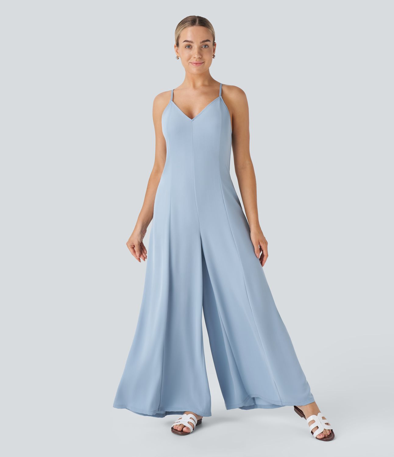 Adjustable strap with backless crossover design, hidden zipper side pockets wide vacation look jumpsuit