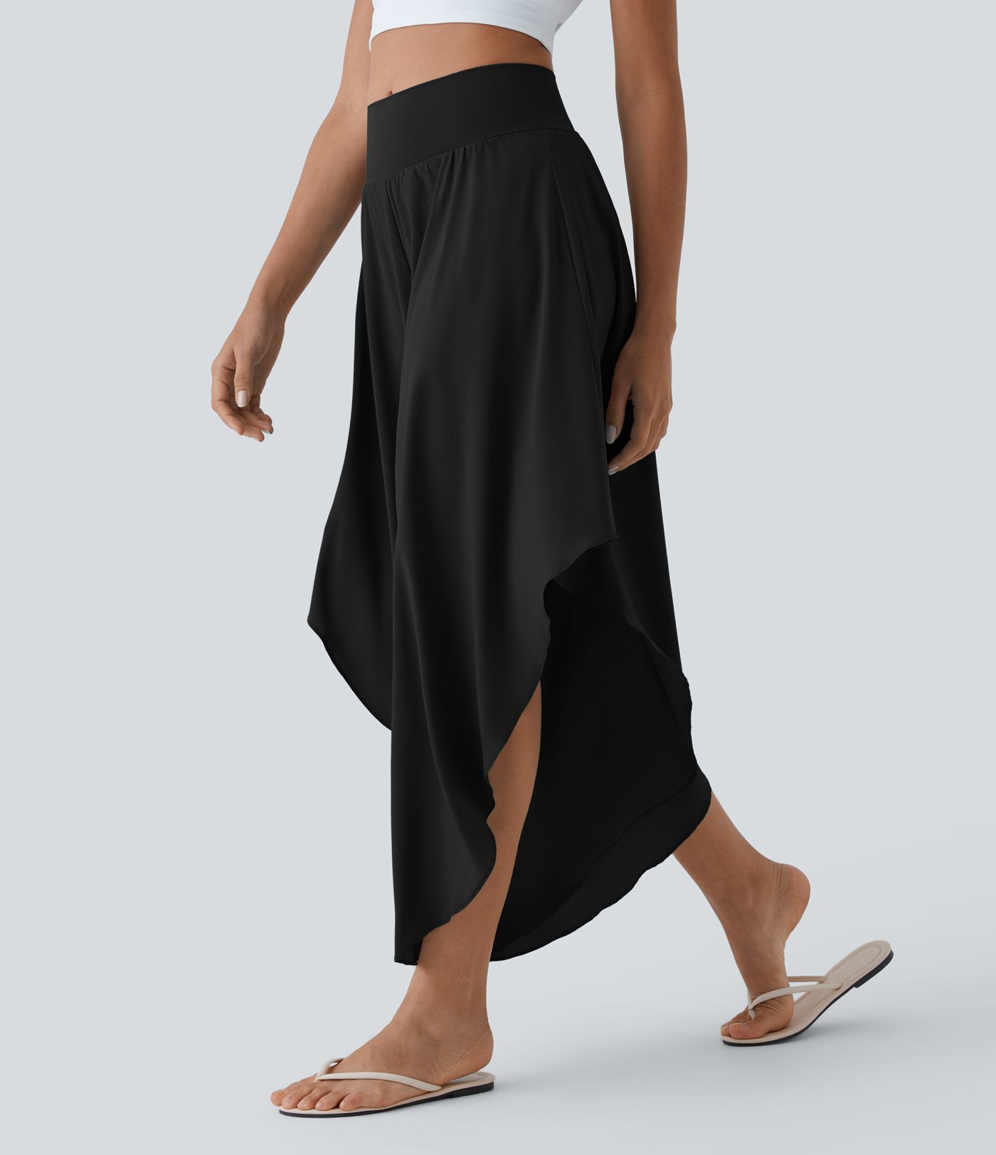 Pantalón palazzo Breezeful™ ancho y fluido de tiro alto elástico con bajo asimétrico y bolsillo
