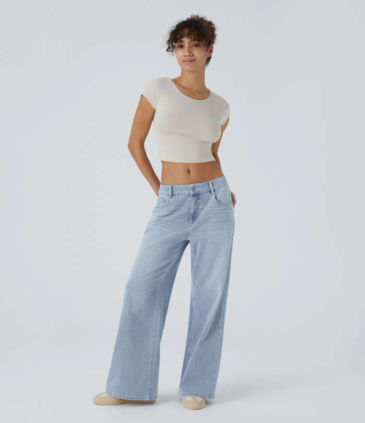 Halara Flex™ Casual, washed baggy jeans in stretch knit denim with a low waist, button, zip fly, multiple pockets and a wide leg