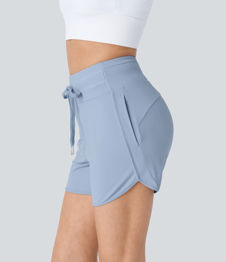 High waist drawstring multiple pocket curve hem yoga shorts