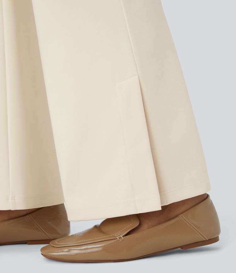 Pantalon Tailleur à taille haute avec poches multiples, fentes et coupe légèrement évasée