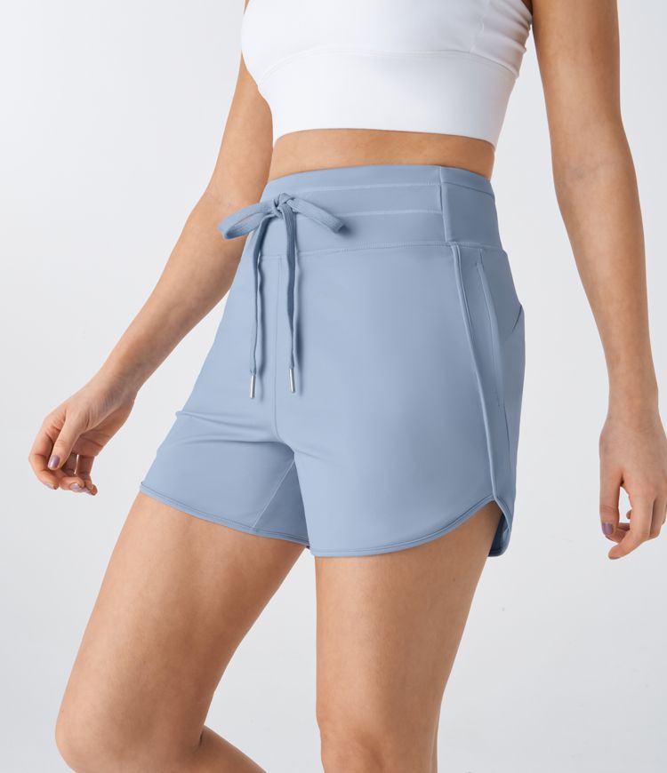 High waist drawstring multiple pocket curve hem yoga shorts