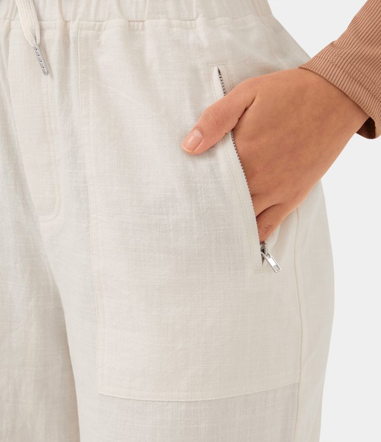 Pantalón tiro alto cordón bolsillo cremallera lateral pierna ancha