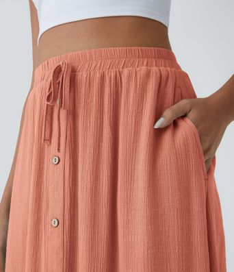 Falda midi casual de cintura alta con bolsillos y cordón fluido
