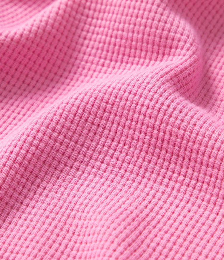 Long-sleeved cotton sweatshirt in oversized fit, V-neck, asymmetric hem, and waffle pattern