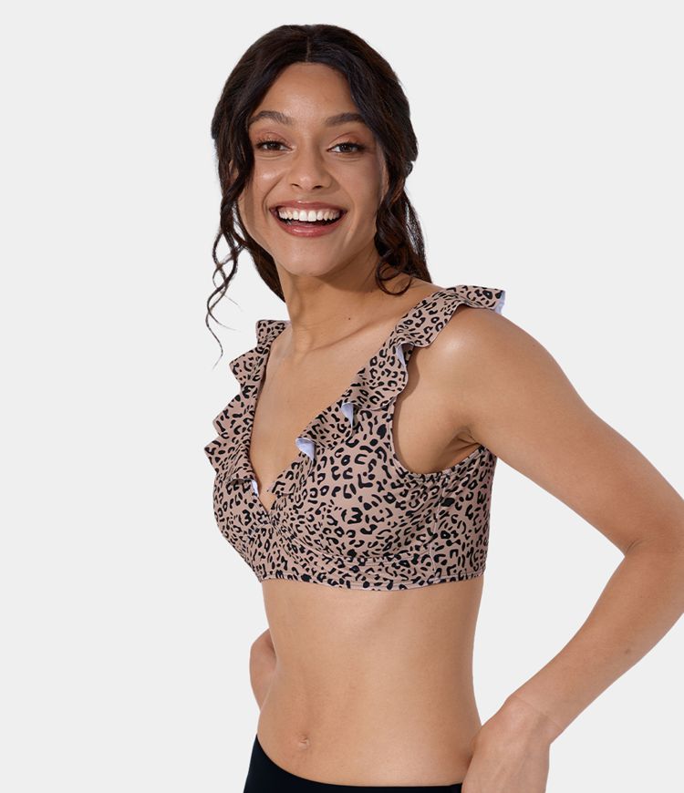 Top de bikini Notya en arena, leopardo y naranja