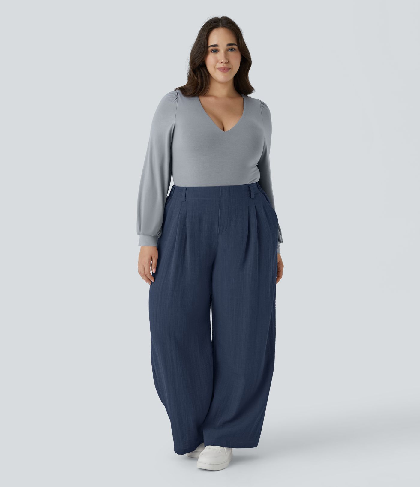 Pantalón tiro alto bolsillo lateral plisado pierna ancha fluido tacto lino talla grande