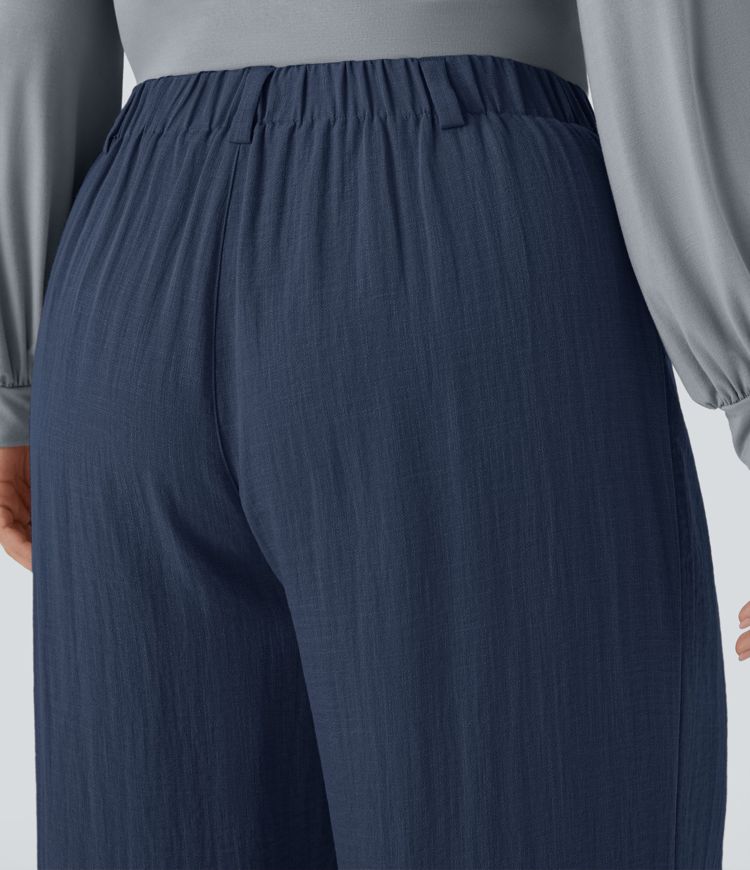 Pantalón tiro alto bolsillo lateral plisado pierna ancha fluido tacto lino talla grande