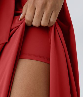 Breezeful™ Falda midi 2 en 1 abertura lateral tiro alto dobladillo curvo fluido acampanado secado rápido