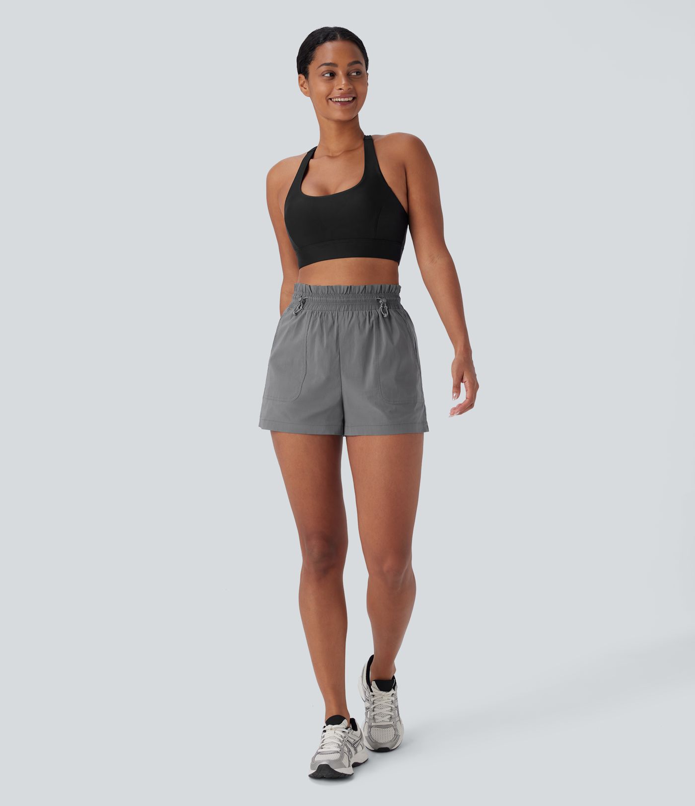 Pantalones cortos de running de cintura alta con bolsillos y cordón