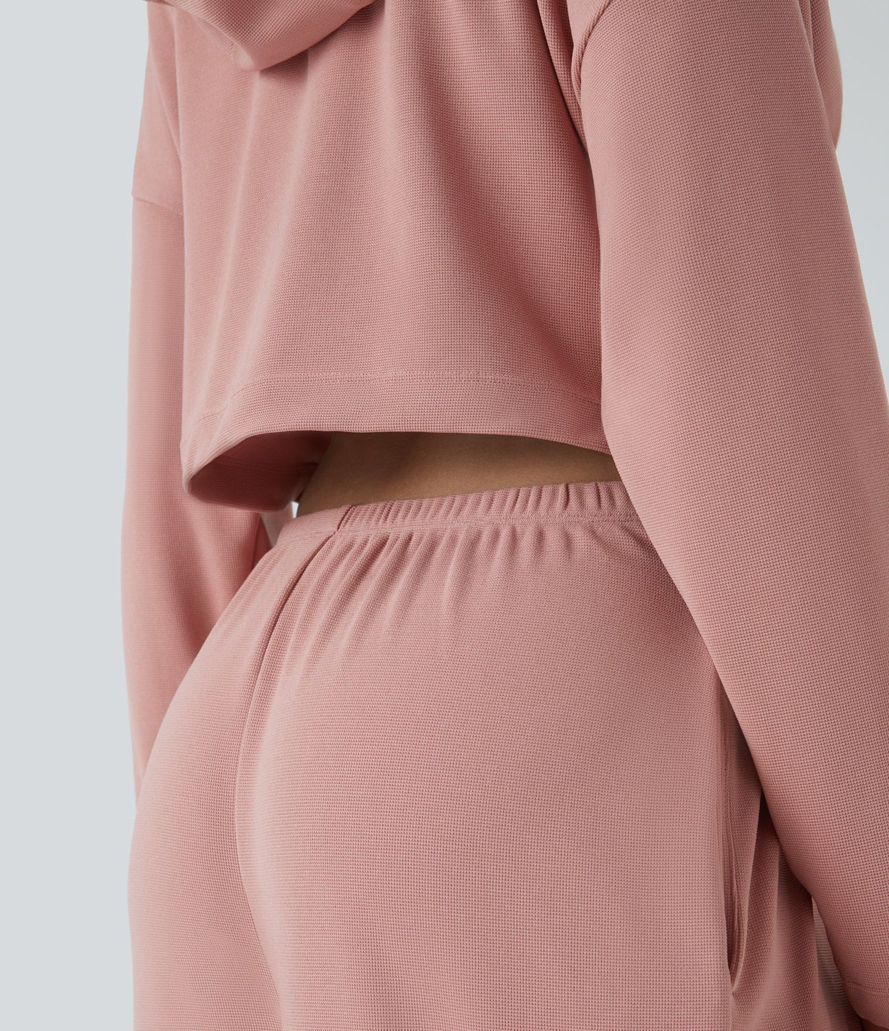 Hood drawstring zipper wrinkled side pocket cutout waffle casual jumpsuit