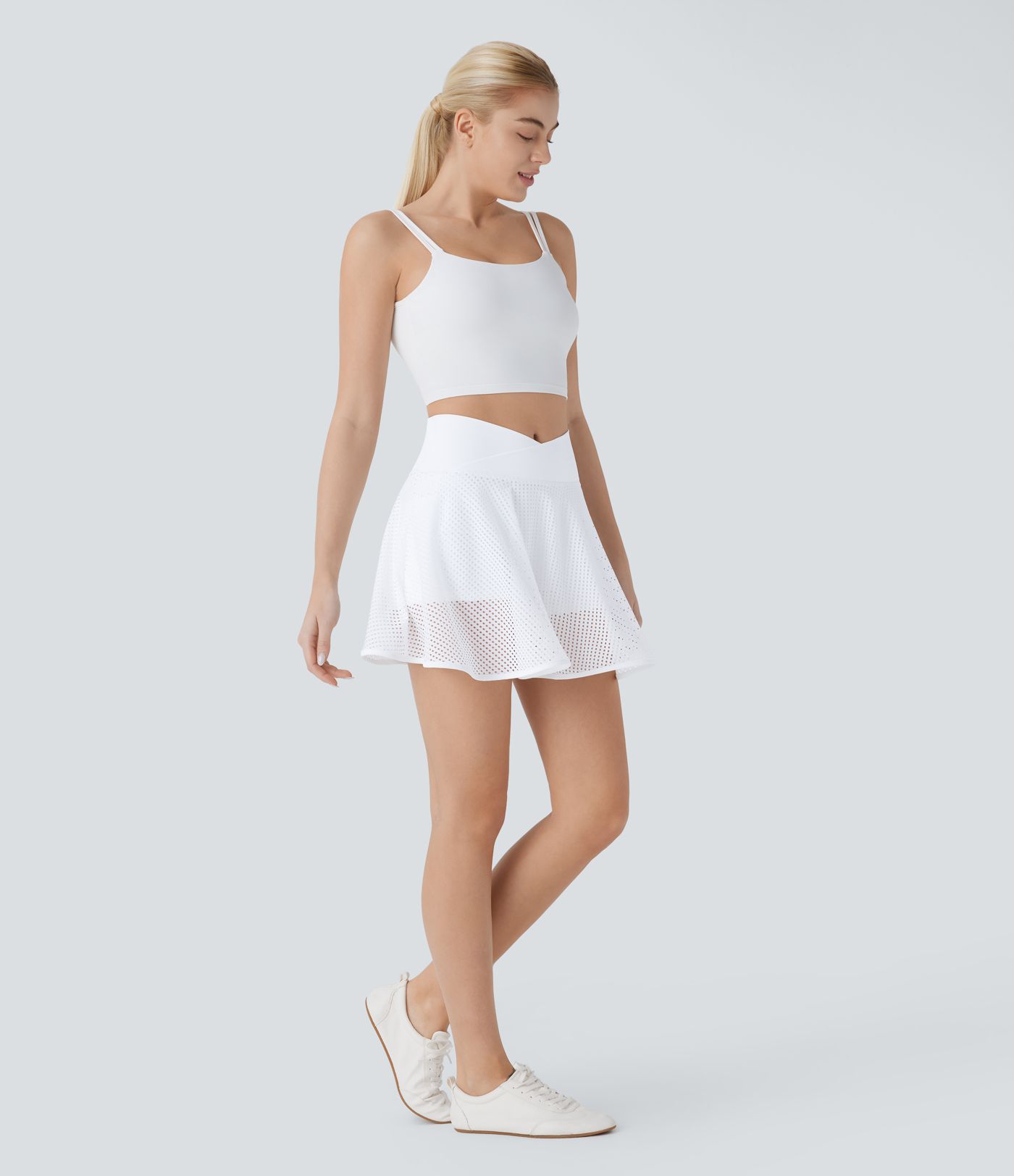 Crossover-Mini-Yogarock mit hoher Taille, 2-in-1-Seitentasche, perforiertem Schlag