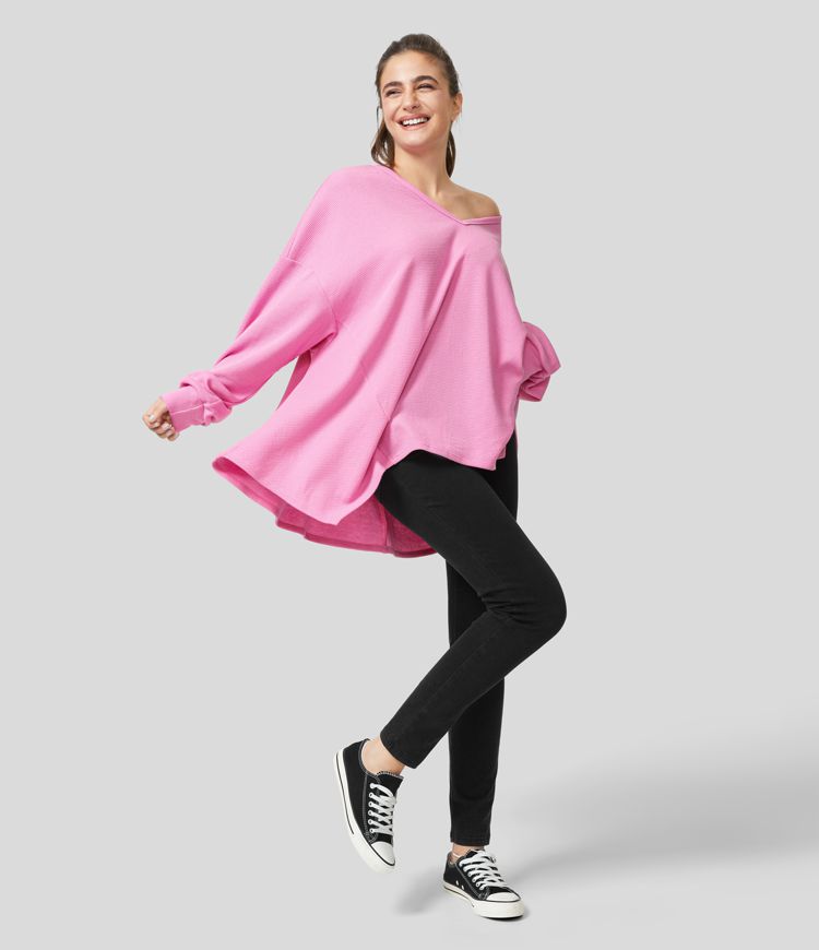 Long-sleeved cotton sweatshirt in oversized fit, V-neck, asymmetric hem, and waffle pattern