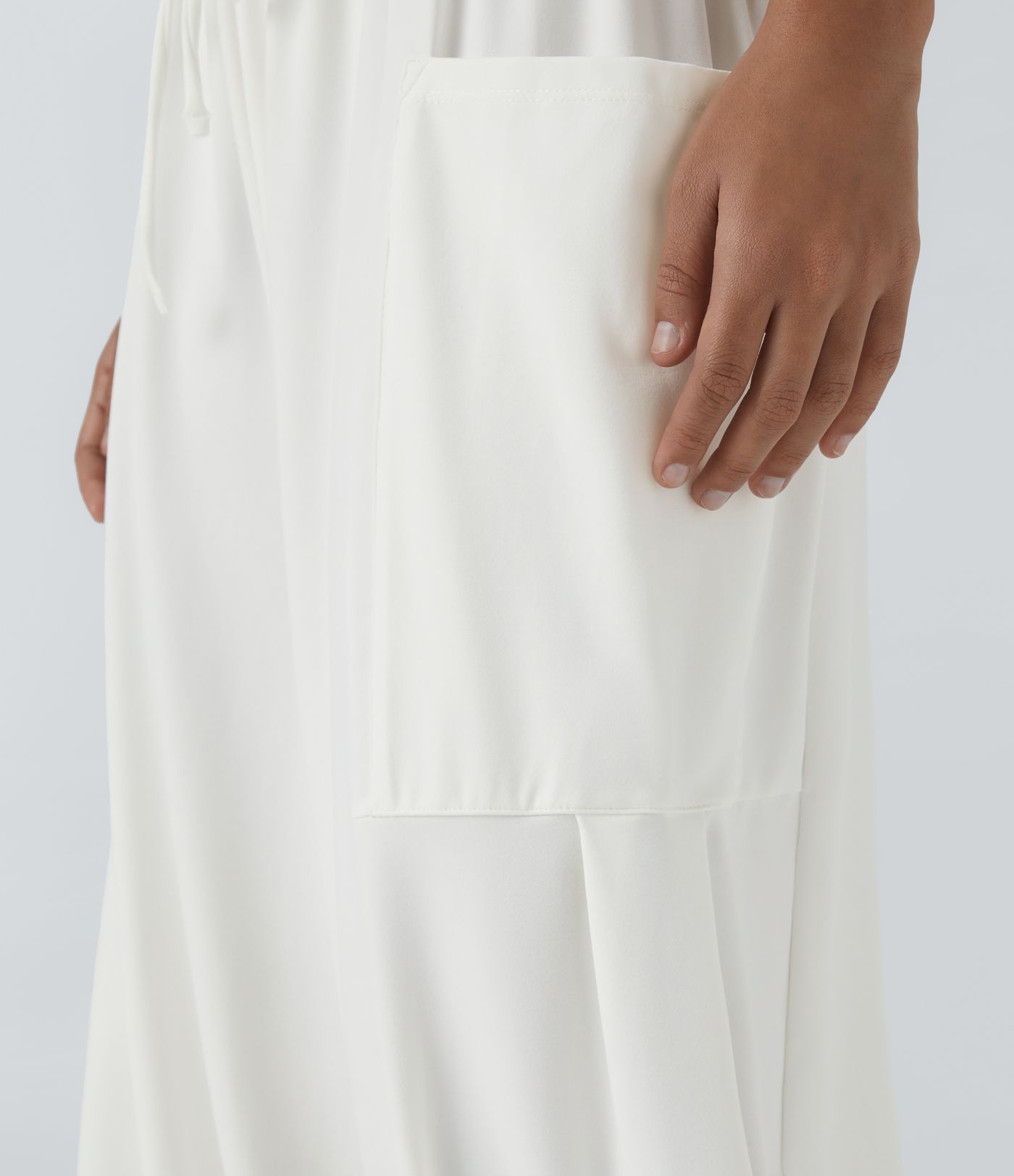 Pantalón pierna ancha fluido palazzo bolsillo lateral cordón ajustable cintura elástica tiro medio