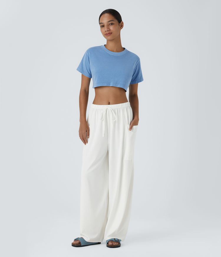 Pantalón pierna ancha fluido palazzo bolsillo lateral cordón ajustable cintura elástica tiro medio