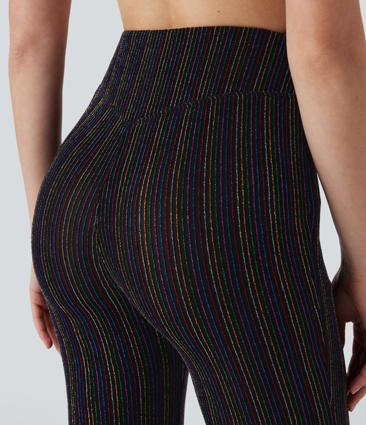 Pantalón acampanado tiro alto bolsillo lateral cremallera raya metálica