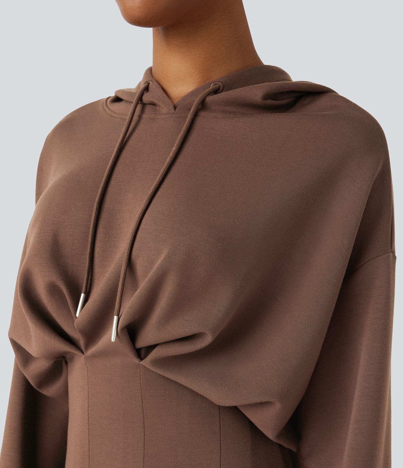 Mini dress with adjustable drawstring, off-the-shoulder design, long sleeves, pleated hem, hip wrap, and hood